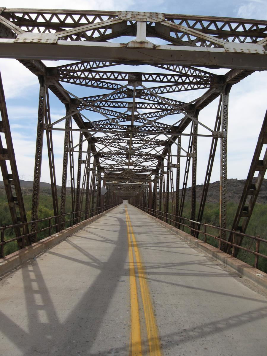looking down the middle of the Gillespie Dam bridge