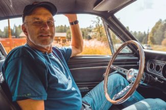 Tom Cotter Sitting In A Mustang