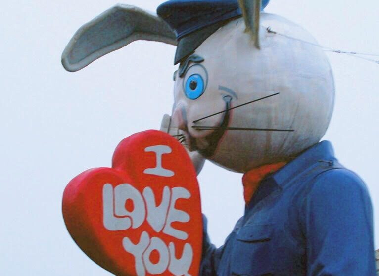Animal Art of a bunny holding a heart that say, "I love you."