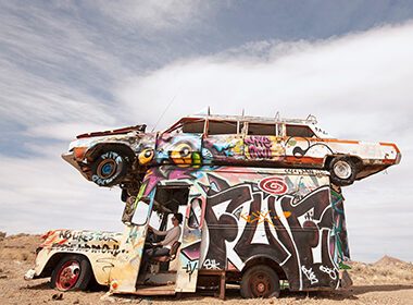 Cars with graffiti on them in the Free-Range Art Highway.